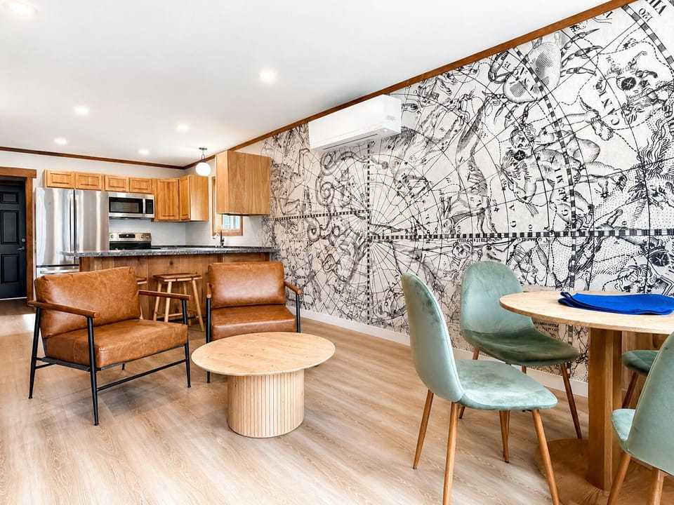 Open living, dining, and kitchen space for easy meals and cozy cabin nights.