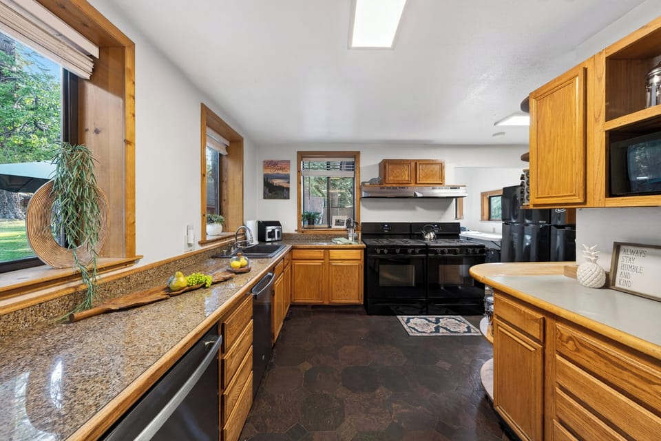 Functional kitchen layout with abundant meal preparation space and modern appliances.