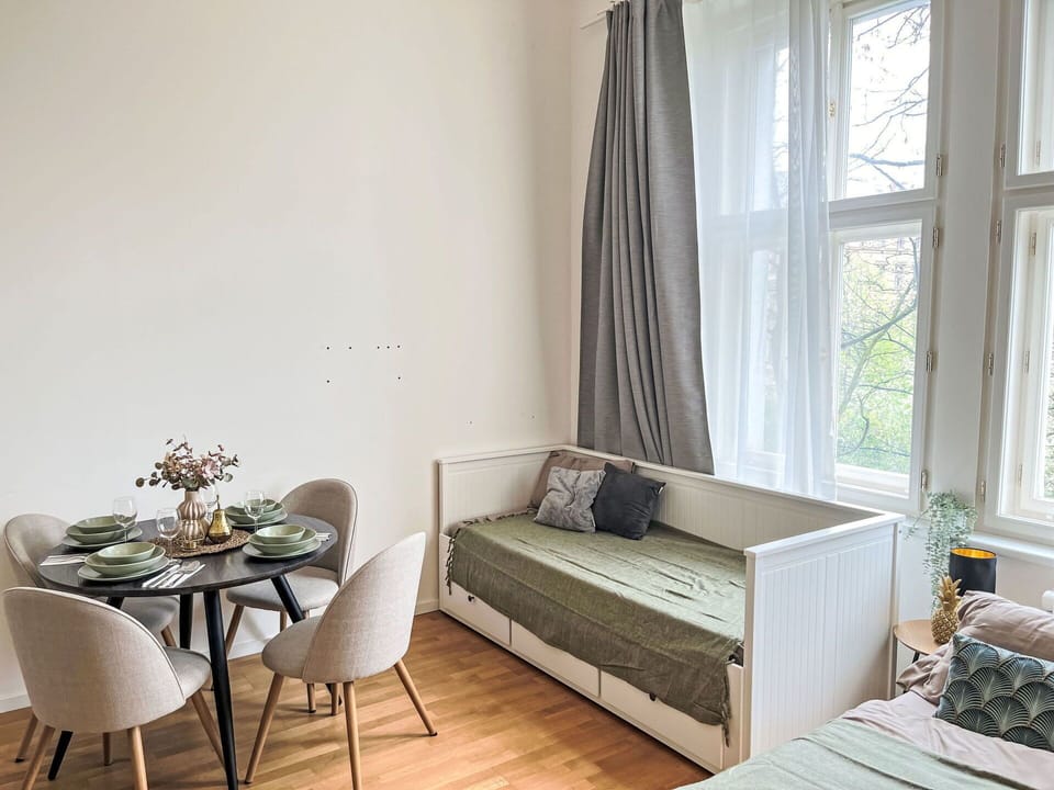 Furniture, Interior Design, Flooring, Floor, Wood, Room, Textile, Home, Couch, Lighting