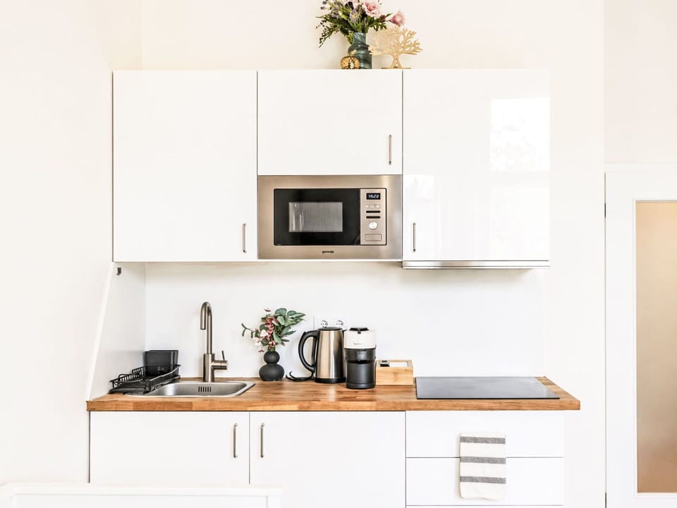 Furniture, Wood, Interior Design, Kitchen Appliance, Kitchen, Countertop, Cabinetry, Flooring, Room, Home