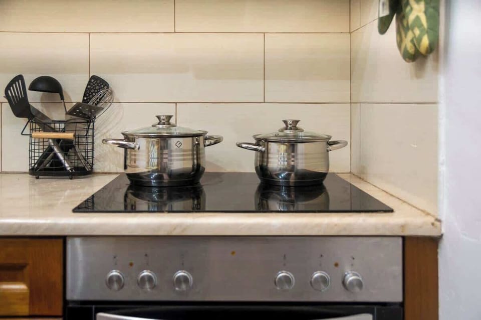 The kitchen is equipped with quality appliances and ample cooking facilities, ensuring a convenient and enjoyable cooking experience. Its bright, functional design makes meal preparation effortless during your stay