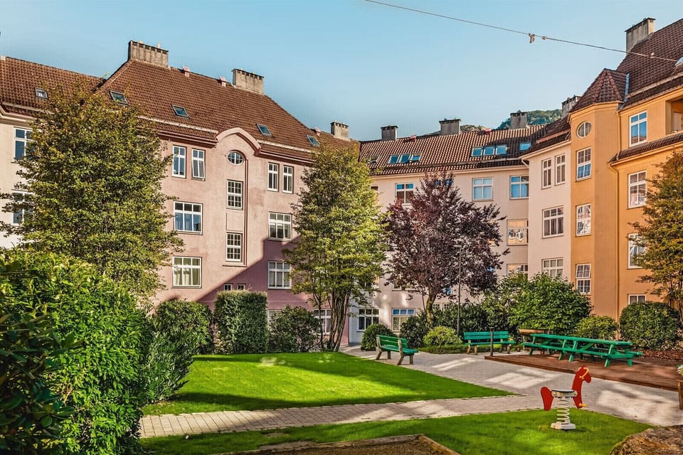 The building has a garden in the back