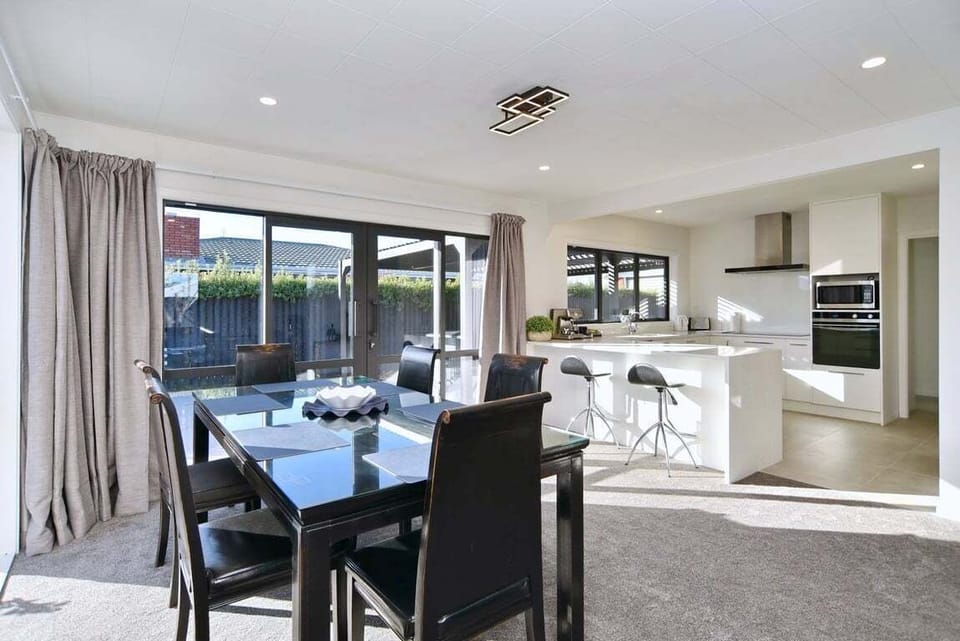 Sit the whole group down to dinner, then slide the doors open to the patio just beyond.