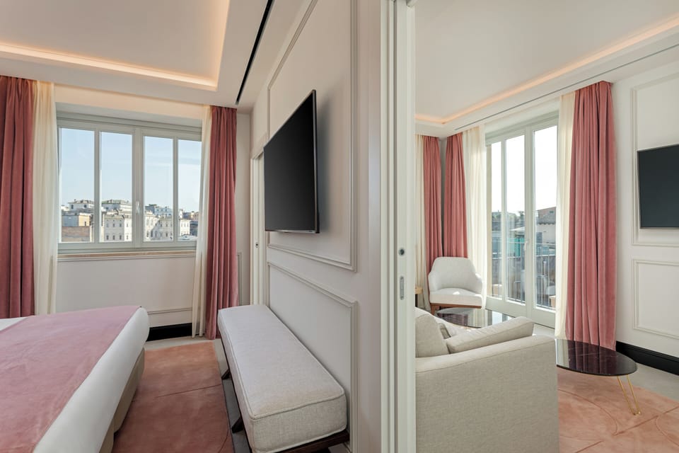 Superior Suite | Living area | 34-inch plasma TV with cable channels