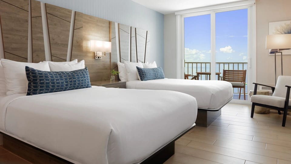 Wake up to sparkling bay views from plush, airy beds.