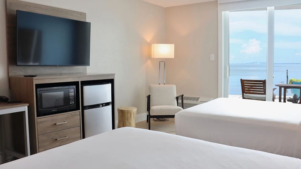 Unwind after the beach with cozy beds and ocean glimpses.