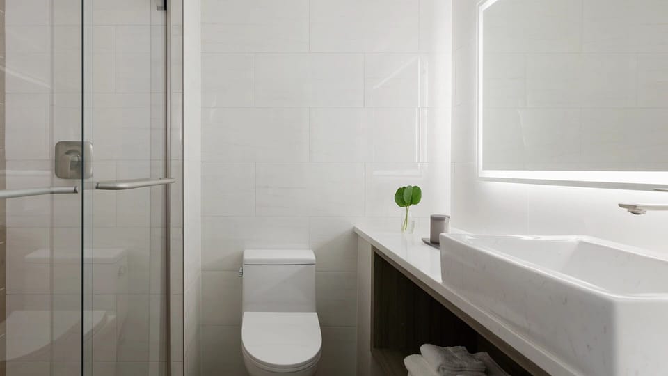 Refresh in a bright, spa-like bathroom with sleek finishes.