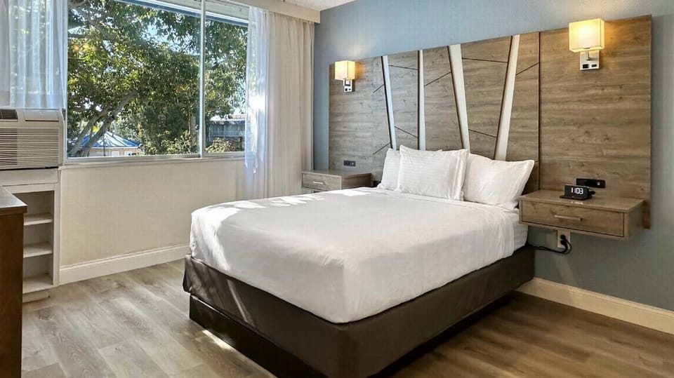 Stretch out and sleep deeply in a serene king bed.