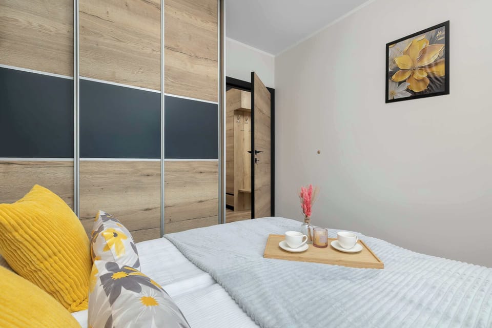 A close-up of the sleeping area with neatly arranged bedding. The inviting setup encourages relaxation and restful nights.