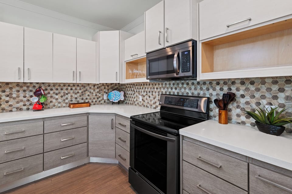 Fully equipped kitchen with stainless steel appliances and everything needed for home-cooked meals
