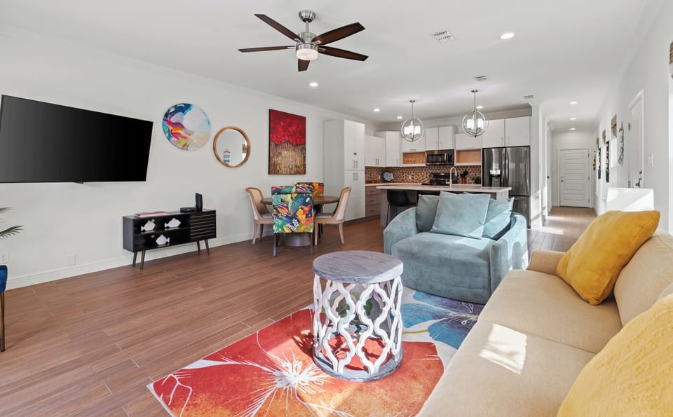 Spacious open-concept living, dining, and kitchen area designed for gathering, entertaining, and relaxing together