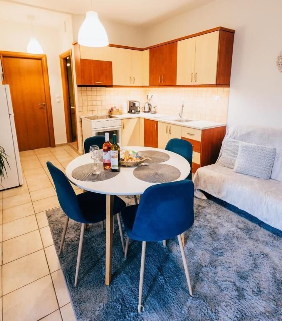 Open-plan dining area with fully equipped kitchen