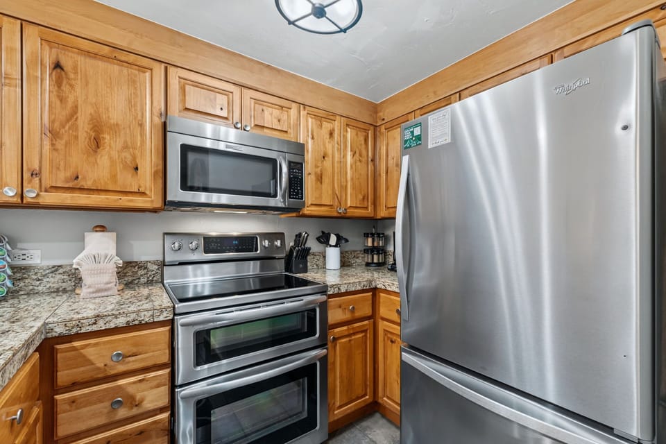 Your fully equipped kitchen features stainless steel appliances, granite countertops, and all the essentials for preparing delicious home-cooked meals during your stay.