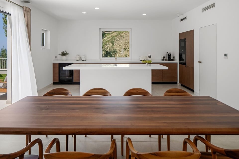 Custom-made kitchen with quartz countertops and premium Miele appliances