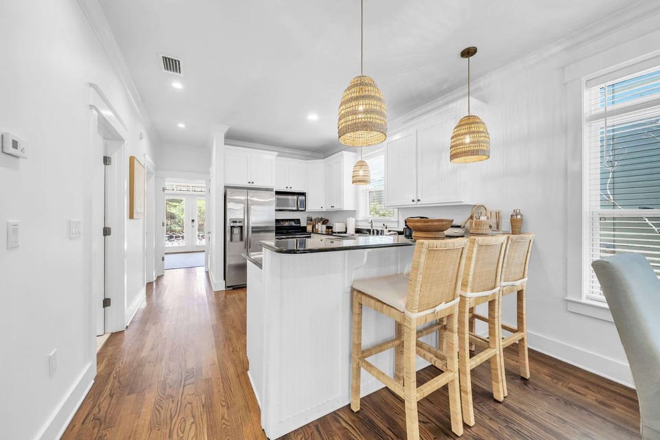 Fully stocked kitchen with island seating for 3