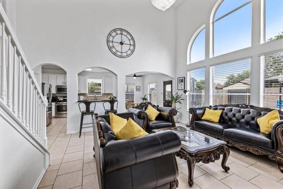 Big windows, bigger vibes in this grand living room