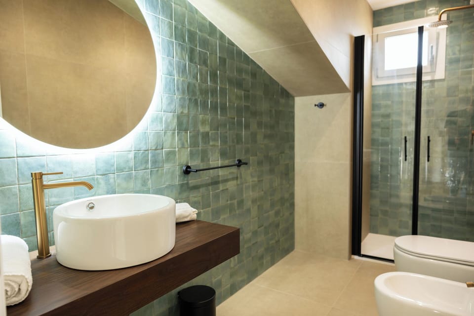 Shower, hair dryer, slippers, towels