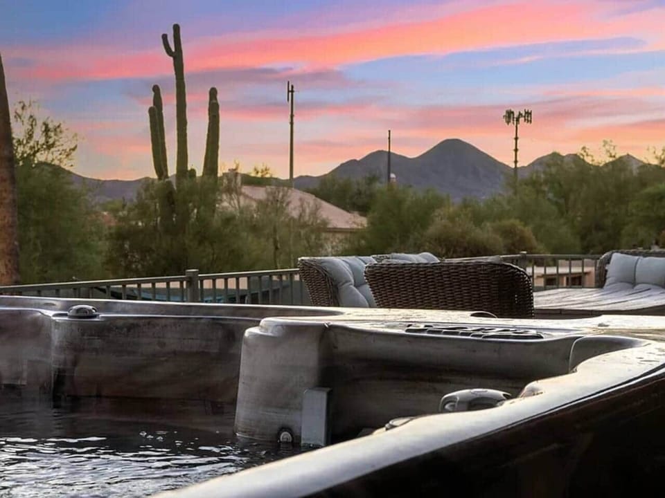 The hot tub overlooks the pool and has a great view of the mountains.