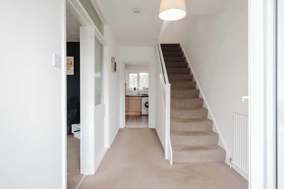 A bright hallway providing easy access between the living areas and upstairs rooms.
