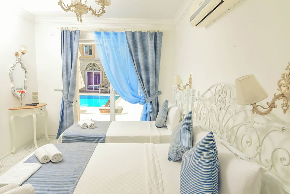 Comfort Triple Room, Pool View | Premium bedding, minibar, in-room safe, desk