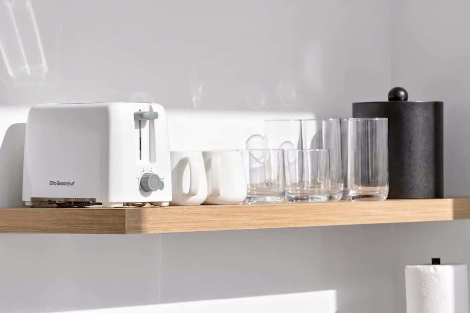 Convenient kitchenette equipped with dining essentials.