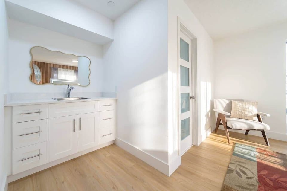 Additional prep area with sink and comfortable seating for added convenience.