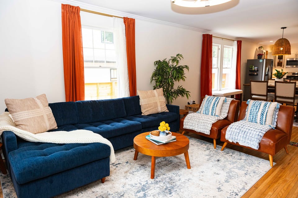 The living room comfortably seats 5+ ppl w/a large Smart TV and surround sound.