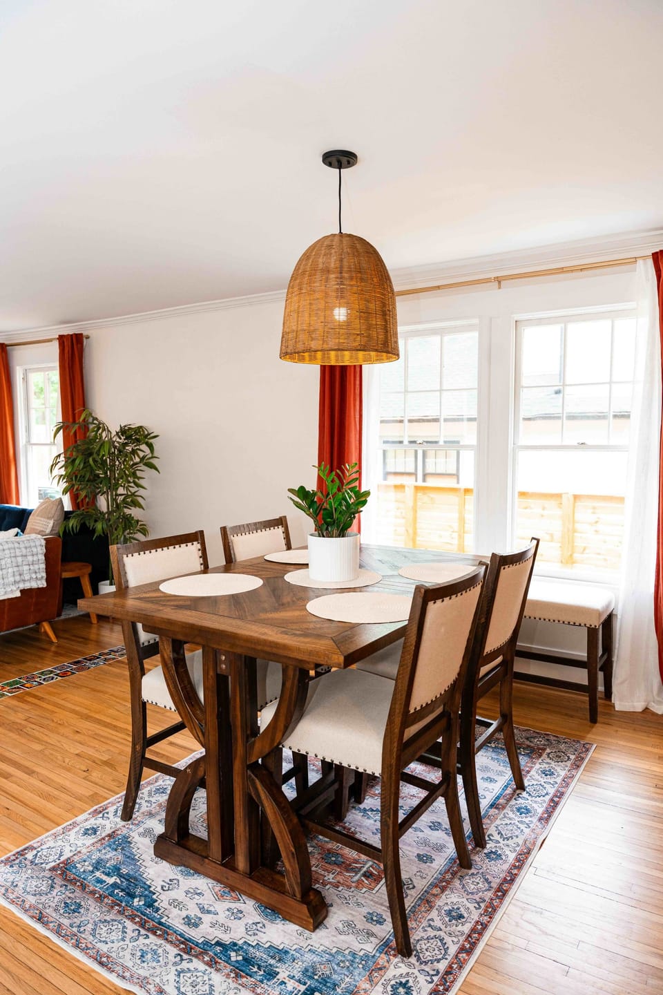 The dining table seats 4 as-is. A leaf is included to extend to a 6-top. 
