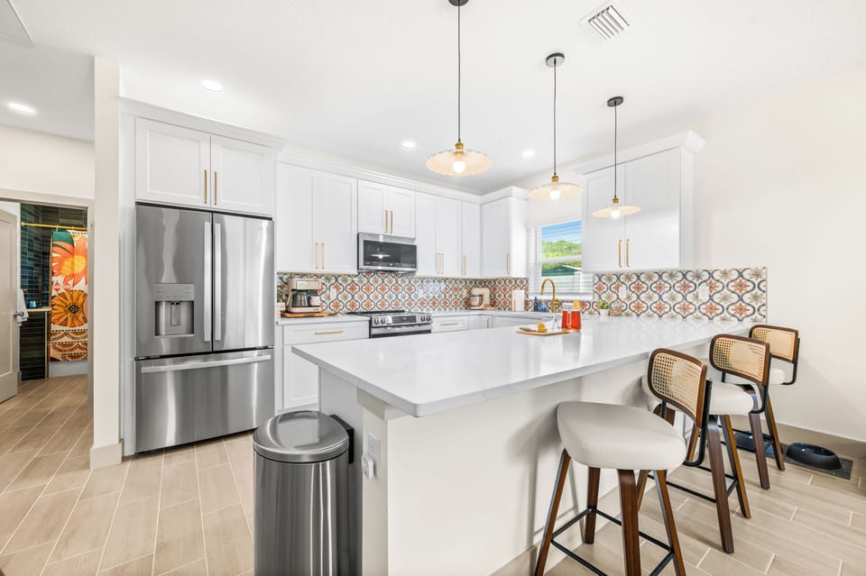 Beautiful open‑concept kitchen linked to the living room and dining area