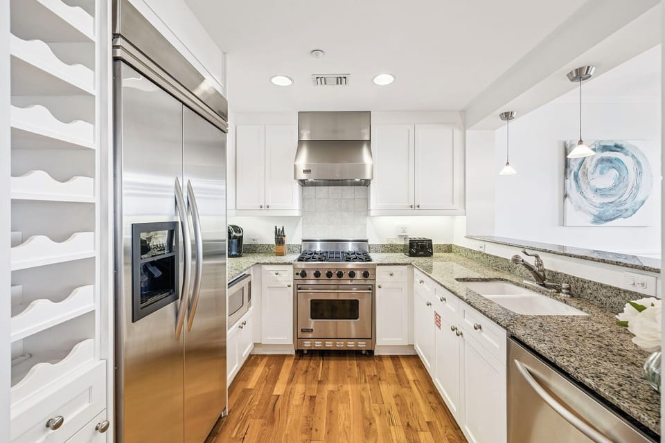 Your chef-ready kitchen features granite countertops, stainless steel appliances, and ample storage—perfect for preparing memorable meals in your cozy vacation home.