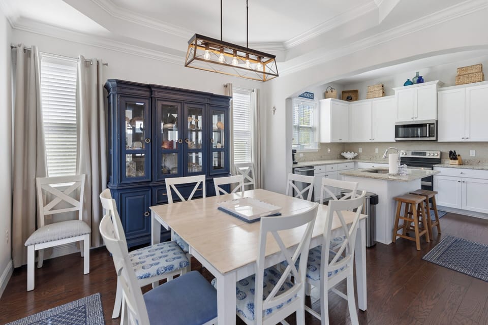 Gather around this bright dining area where family meals become cherished memories. The open-concept kitchen lets you prep and chat seamlessly, with granite counters, stainless appliances, and ample storage ready for your culinary adventures.