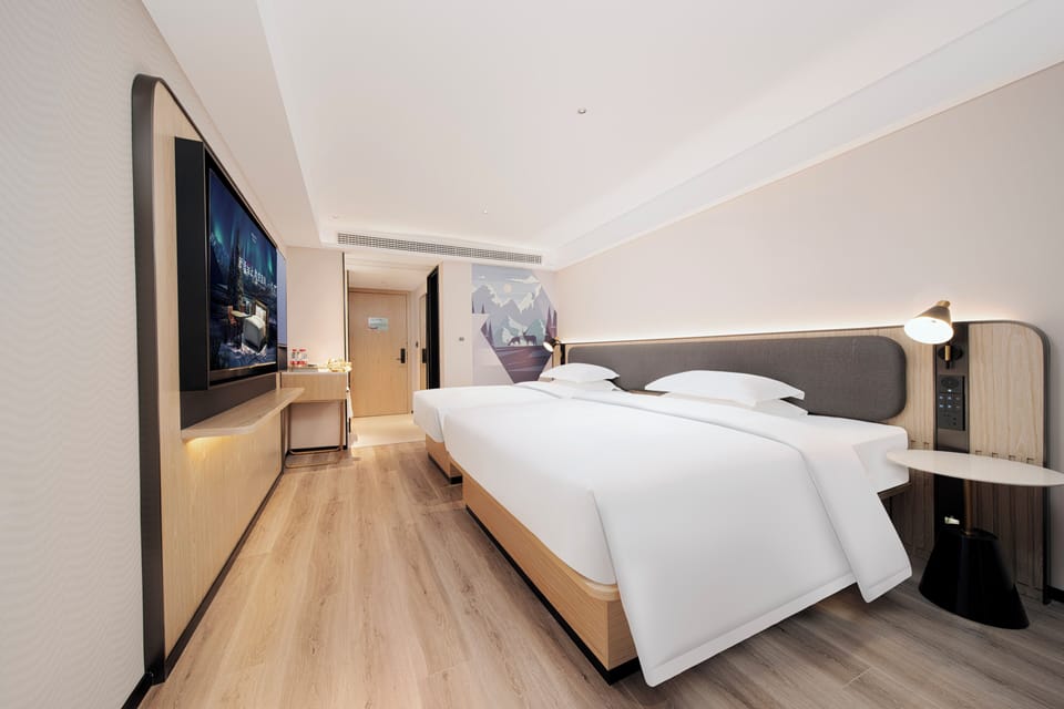 Premium bedding, down comforters, pillowtop beds, free minibar