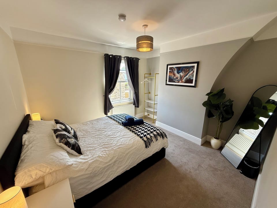 Bright, stylish master bedroom (king) with natural light and stylish modern touches