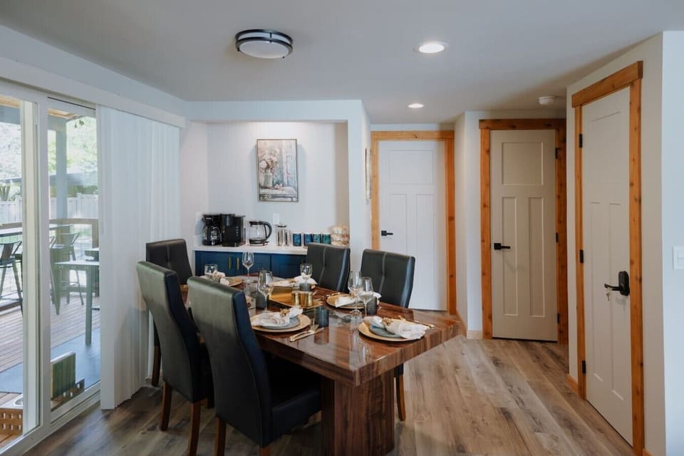 Share meals and memories around the dining table with a thoughtfully stocked coffee bar nearby for your morning routine.