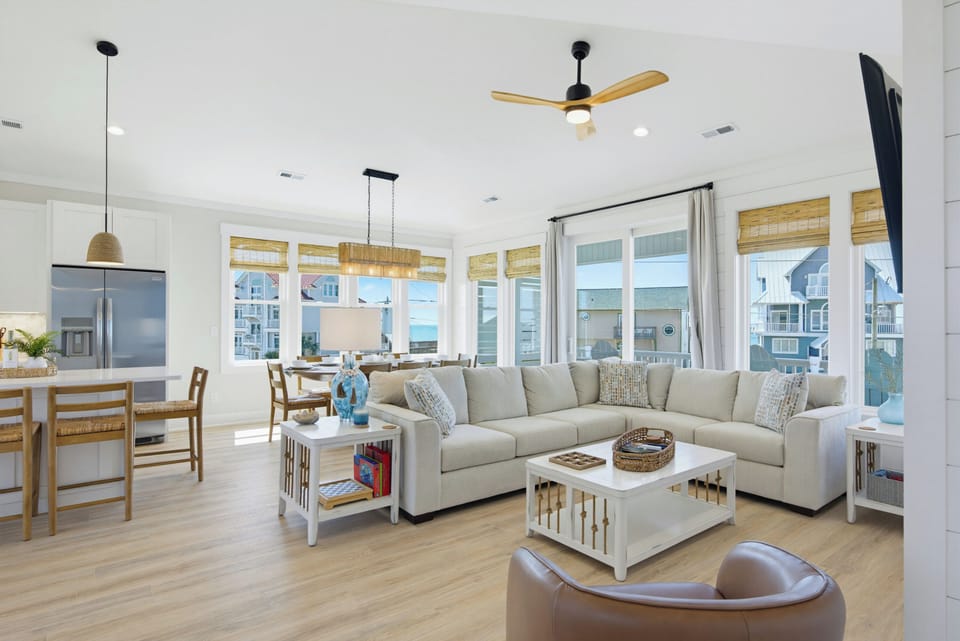 Open and bright living room with plenty of seating and great views.
