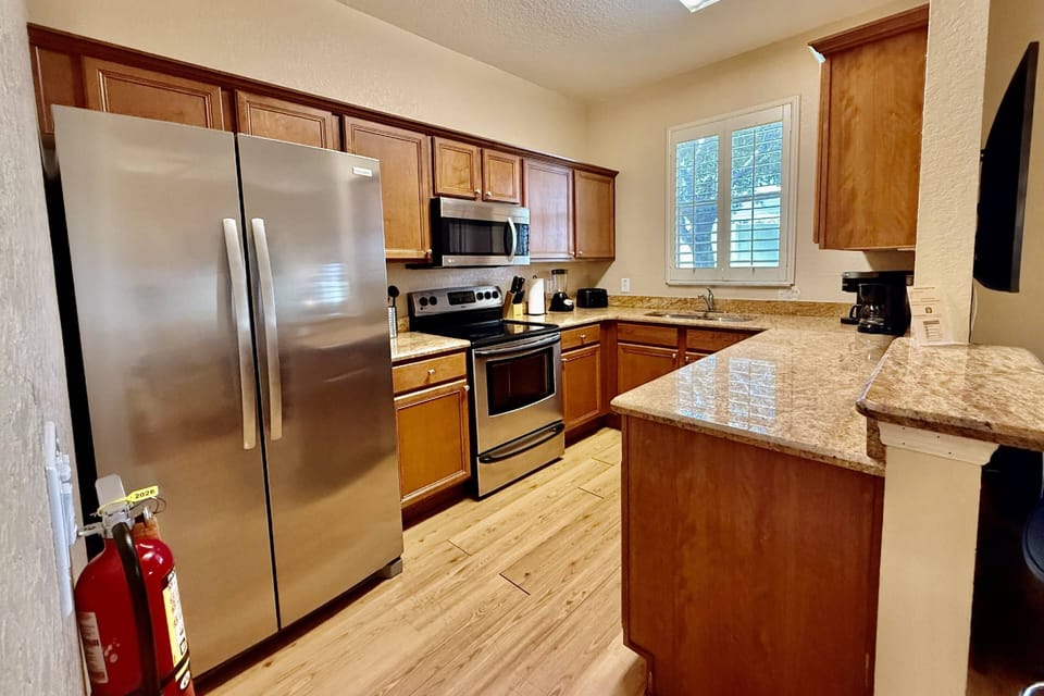 Fully Equipped kitchen with stainless steel appliances - new refrigerator!