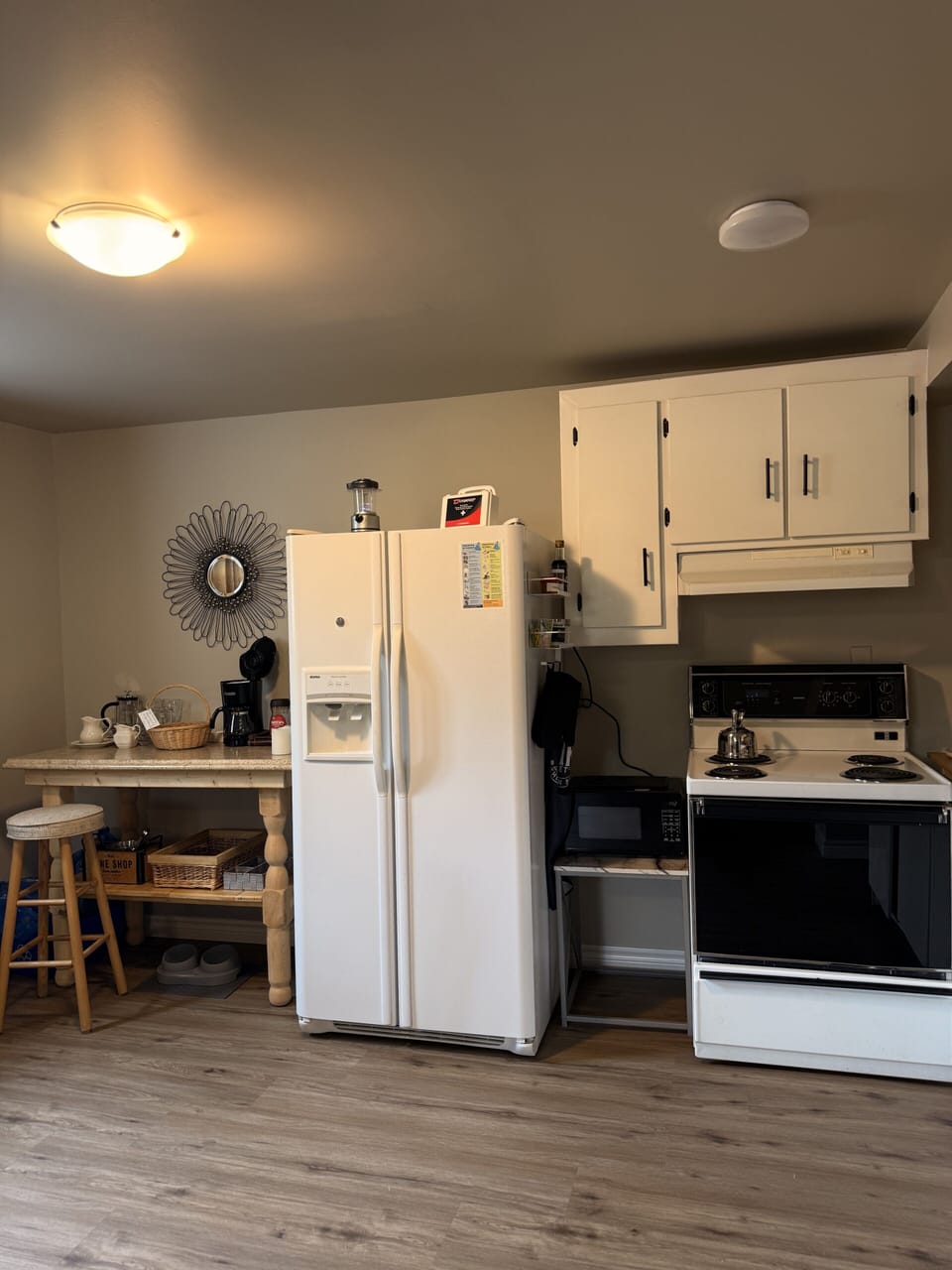 Cozy kitchen with full-size appliances, coffee station, and breakfast bar