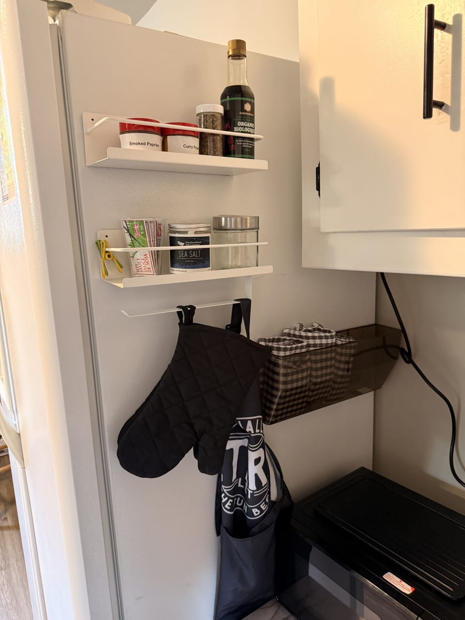 Well-stocked kitchen corner with cooking essentials and smart storage