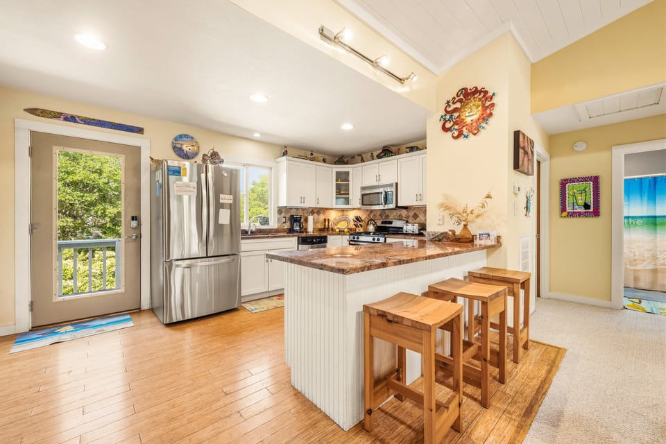 Whip up a delicious meal the whole family will enjoy in the fully-equipped kitchen with a counter bar.