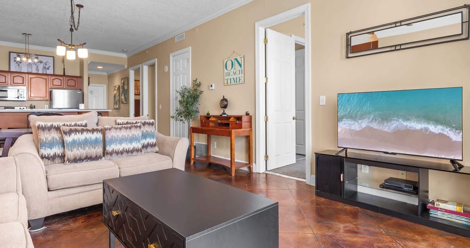 A bright living space with ocean views, a Smart TV, and a queen sofa sleeper for extra comfort
