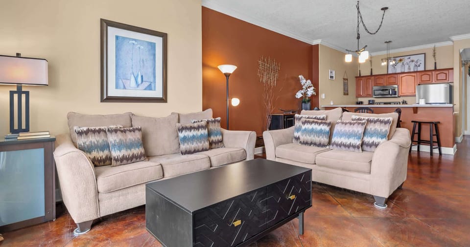 A bright living space with ocean views, a Smart TV, and a queen sofa sleeper for extra comfort