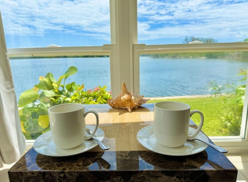 Start your day with coffee and peaceful river views just steps from the living room.