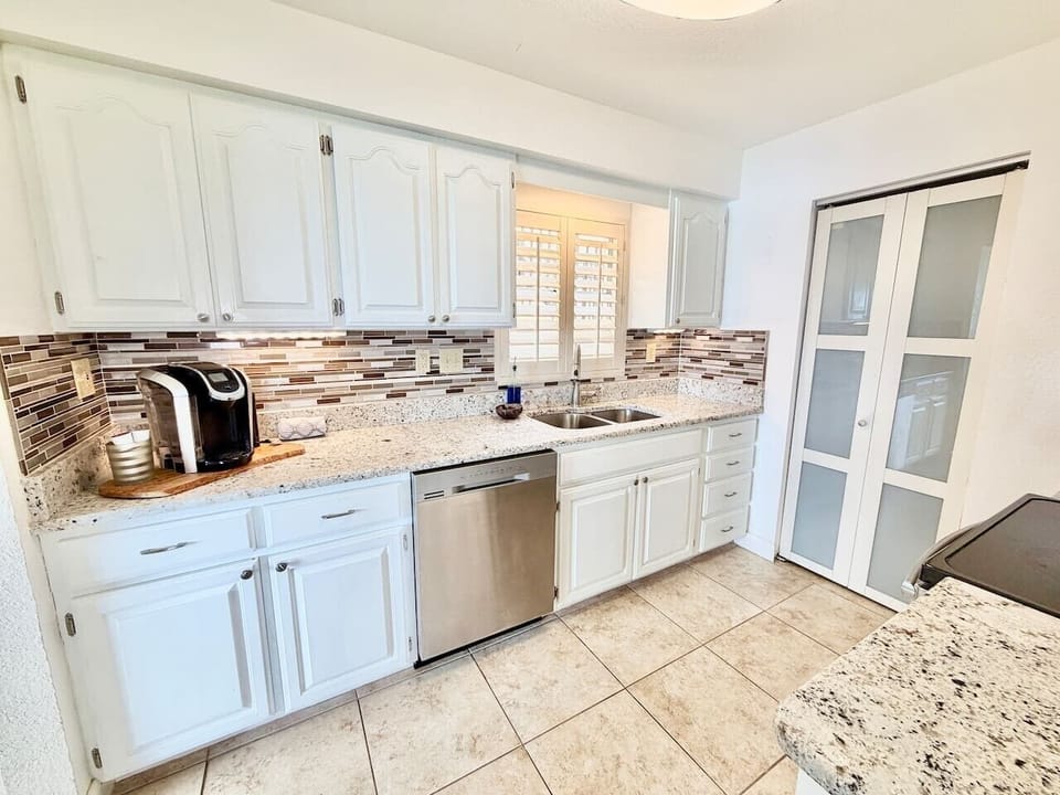Fully equipped kitchen stocked for preparing meals at home.