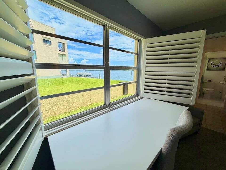 Water views right from the bedroom workspace.