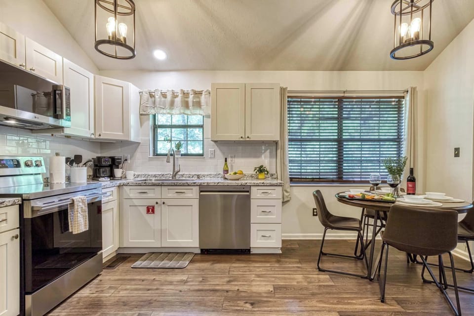 Enjoy meals together in the spacious dining area with the fully equipped kitchen just steps away, making cooking and serving easy for everyone.