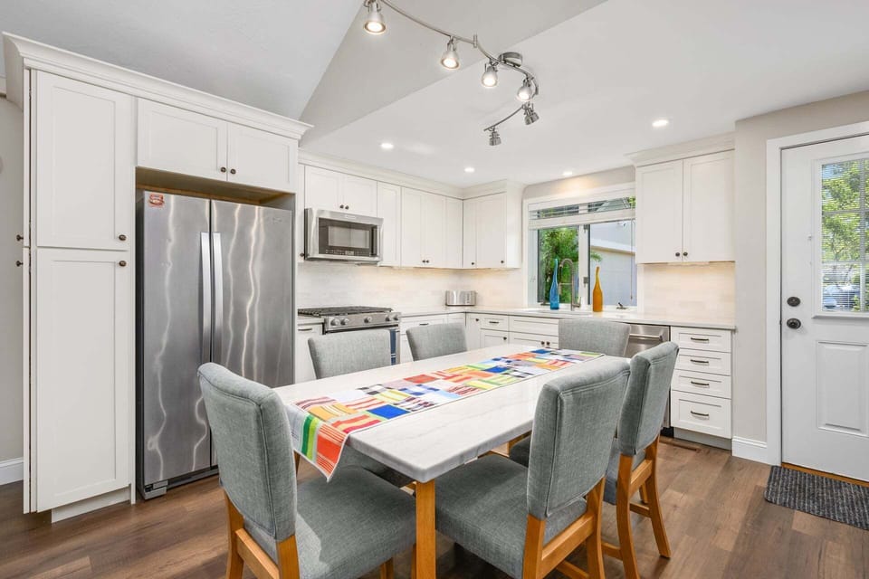 A dining table positioned within the kitchen area, creating a convenient and functional space for meals