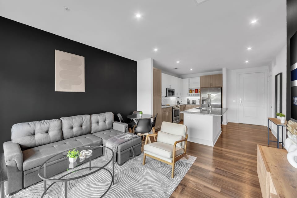 Modern open-concept living with sleek kitchen and cozy lounge area