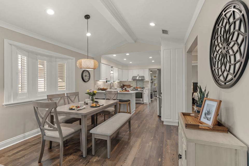 Generous open floor plan looking from the dining area straight through to the kitchen.