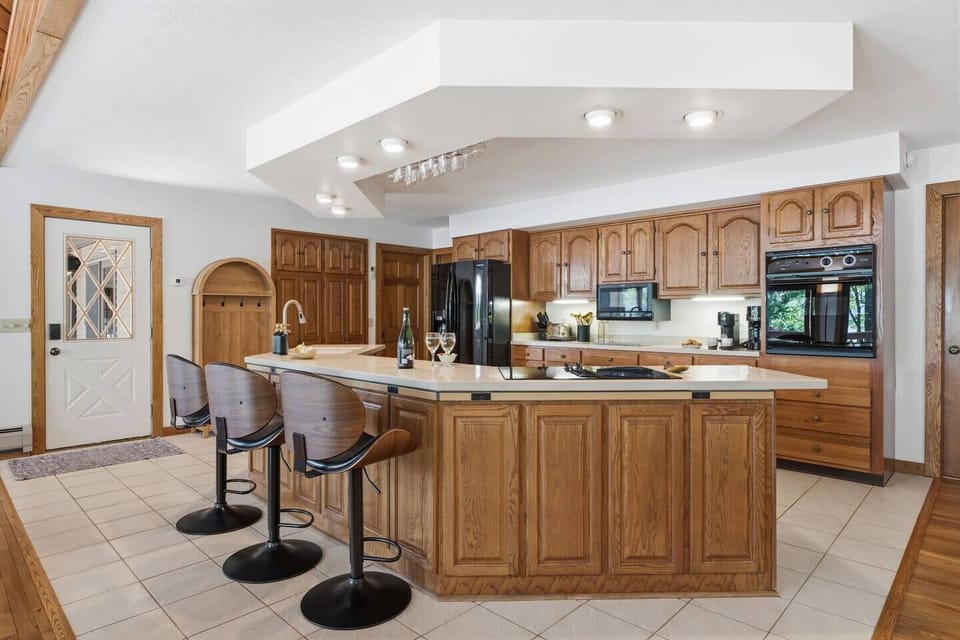 Fully equipped kitchen with a large island and seating.