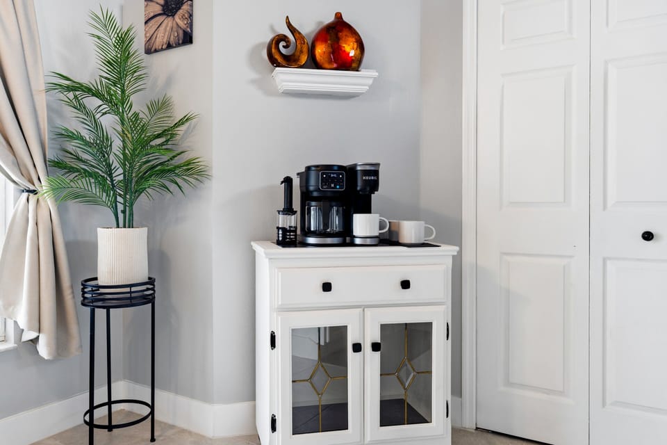 Start your day with ease at the dedicated coffee station, complete with a coffee maker, mugs, and a convenient setup for your morning routine.